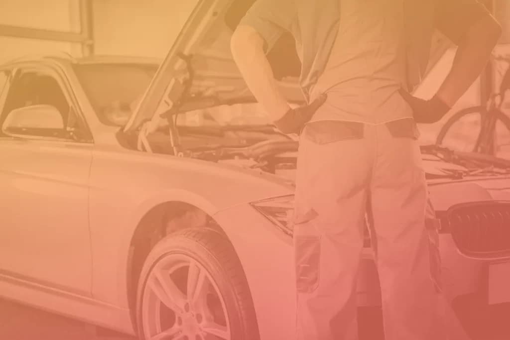 Technician looking over a vehicle